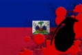 Haiti flag and MK2 frag grenade in red blood. Concept for terror attack or military operations with lethal outcome