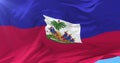 Haitian flag waving at wind with blue sky, loop