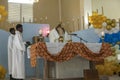 The Haitian priest lifts up the chalice at mass