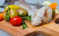 Tail of hake by rustically served with boiled potatoes, carrots and tomatoes