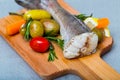 Tail of hake by rustically frying and served with boiled potatoes and tomatoes