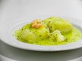 Hake in green sauce.