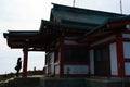 Hakone, Japan. April 04, 2023: Japanese woman pray at Hakone Mototsumiya Shrine.