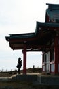 Hakone, Japan. April 04, 2023: Japanese woman pray at Hakone Mototsumiya Shrine.