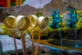 HAKONE, JAPAN - JULY 02, 2017: Bronze bowl with a stick to takle water with ablurred fountain with a bronze dragon in