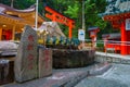 HAKONE, JAPAN - JULY 02, 2017: Chinesse letter in a rock sign, with a fountain with a bronze dragon in Japan