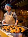 HAKONE, JAPAN - JULY 02, 2017: Unidentified Japanese man cooking food at street, based on mobile food stands where Royalty Free Stock Photo