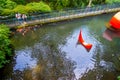 HAKONE, JAPAN - JULY 02, 2017: Unidentified people looking at red abstract installation in the pond of Hakone open air Royalty Free Stock Photo