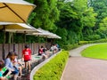 HAKONE, JAPAN - JULY 02, 2017: Unidentified people refresing their foots inside of water at Hakone Open-Air Museum or Royalty Free Stock Photo