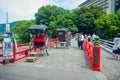 HAKONE, JAPAN - JULY 02, 2017: Unidentifies people over a red bridge at the river at Odawara, transition point to Hakone