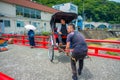 HAKONE, JAPAN - JULY 02, 2017: Unidentifies people over a red bridge at the river at Odawara, transition point to Hakone