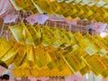 HAKONE, JAPAN - JULY 02, 2017: Yellow fortune paper written in the city of Hakone