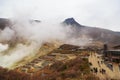 Hakone, Japan - October 23, 2016 : Tourist at Owakudani smoky active Sulphur vent at valley in Fuji volcanic zone Hakone, Japan.