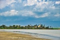 The mosque Hala Sultan Tekke on the bank of Larnaca Salt Lake, Cyprus. Dark thunderclouds Royalty Free Stock Photo