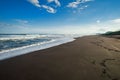 Halaktyr beach. Kamchatka. Russian federation. Dark almost black color sand beach of Pacific ocean. Stone mountains and