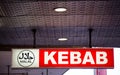 Halal Logo on Red Kebab restaurant sign.