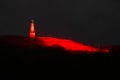 Halde Rheinpreussen, Moers, bathed in ruby red light with mining light