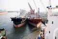 Haldia, India, October, 27, 2020. Seagoing vessels, tugboats at the port under cargo operations and underway.