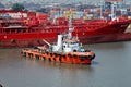 Haldia, India, October, 27, 2020. Seagoing vessels, tugboats at the port under cargo operations and underway.