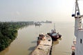 Haldia, India, October, 27, 2020. Seagoing vessels, tugboats at the port under cargo operations and underway.