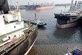 Haldia, India, October, 27, 2020. Seagoing vessels, tugboats at the port under cargo operations and underway.