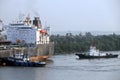 Haldia, India, October, 27, 2020. Seagoing vessels, tugboats at the port under cargo operations and underway.