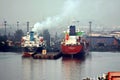 Haldia, India, October, 27, 2020. Seagoing vessels, tugboats at the port under cargo operations and underway.