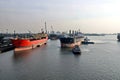 Haldia, India, October, 27, 2020. Seagoing vessels, tugboats at the port under cargo operations and underway.