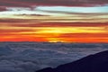 Sunrise at Haleakala Volcano with clouds and a colorful sky in Maui Hawaii Royalty Free Stock Photo