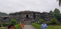 Halebidu temple surrounded by full of greenery and lots of visitors, Karnataka