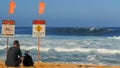 HALEIWA, UNITED STATES OF AMERICA- JANUARY 13 2015: wide shot of the beach and the surfers in the water at pipeline