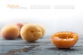 Half apricot and blurred fruits behind on old gray wood Royalty Free Stock Photo