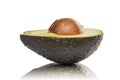 Half of an avocado with kernel and reflection Royalty Free Stock Photo