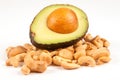 Half avocado on pile of Cashew nuts Royalty Free Stock Photo