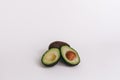 Half of avocado on white background. top view