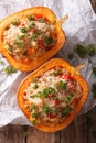 Half baked pumpkin with couscous, meat, vegetables and cheese Royalty Free Stock Photo