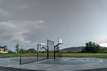 Half basketball courts with view of majestic mountain and overcast gray sky Royalty Free Stock Photo