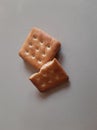 Half a biscuit on a biscuit on a white ladie.? Royalty Free Stock Photo