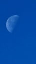 Half blue moon and blue sky Royalty Free Stock Photo
