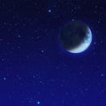 half blue moon with star at the night sky Royalty Free Stock Photo