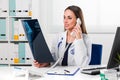 Female doctor looking at patients x-ray in her office Royalty Free Stock Photo