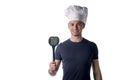 Half Body Portrait of Young Male Chef Wearing White Hat with Black Ladle on Hand While Looking at the Camera Royalty Free Stock Photo