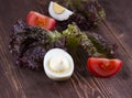 Half of boil egg handful of mayonnaise. egg, tomato, lettuce on Royalty Free Stock Photo