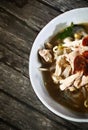 A half bowl of chicken soto Indonesian authentic food