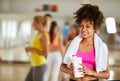 Half-caste female refreshing with protein shake