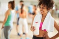 Half-caste girl with protein shake after training