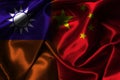 Half of China flag and Taiwan flag on silk fabric for both countries political conflict and war concept Royalty Free Stock Photo