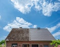 A half cleaned house roof shows the before and after effect of a roof cleaning\'. Royalty Free Stock Photo