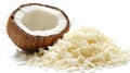 Half a coconut with shredded coconut flakes spilling on a white table top view Royalty Free Stock Photo