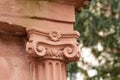 Half column in ionic order in pink sandstone Royalty Free Stock Photo